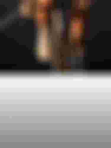 Close-up of cyclist's hands on drop handlebars, front wheel and white shoes pedaling on a sunlit road.