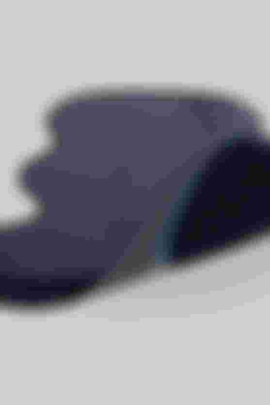 Close-up of the SQ-Pad ONE10 showing its thin, contoured construction and breathable, textured material.