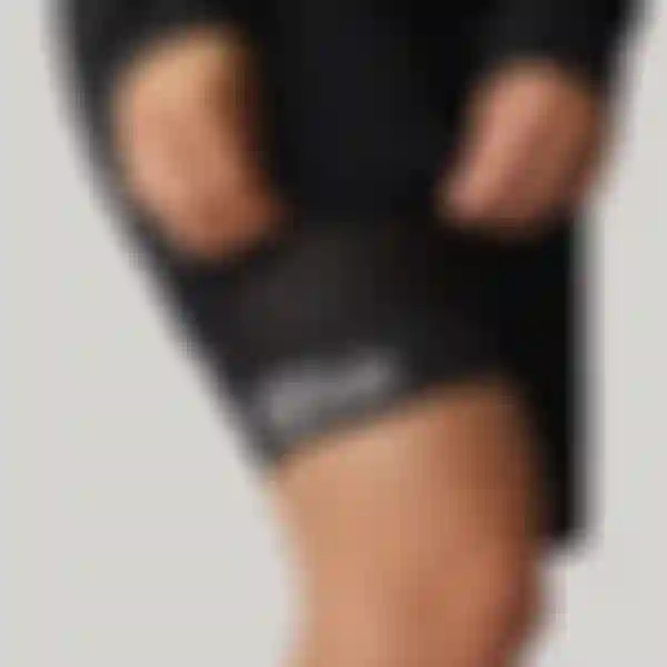 Close-up of the leg cuff on SQlab ONE10 cycling shorts, showing perforated fabric and SQlab logo.