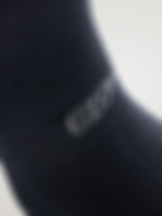 Close-up of a dark cycling sock with textured knit and the SQlab logo on the side.