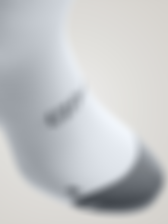 White cycling sock with grey toe section, showing the SQlab logo and textured knit around the ankle.