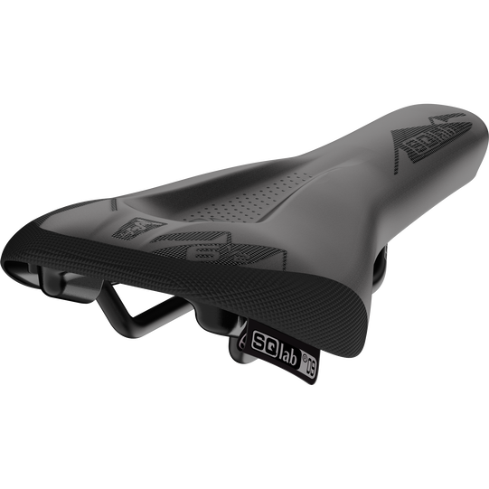 SQlab 6½ ERGOWAVE OX kids bike saddle in charcoal black with OX graphic, three-quarter view