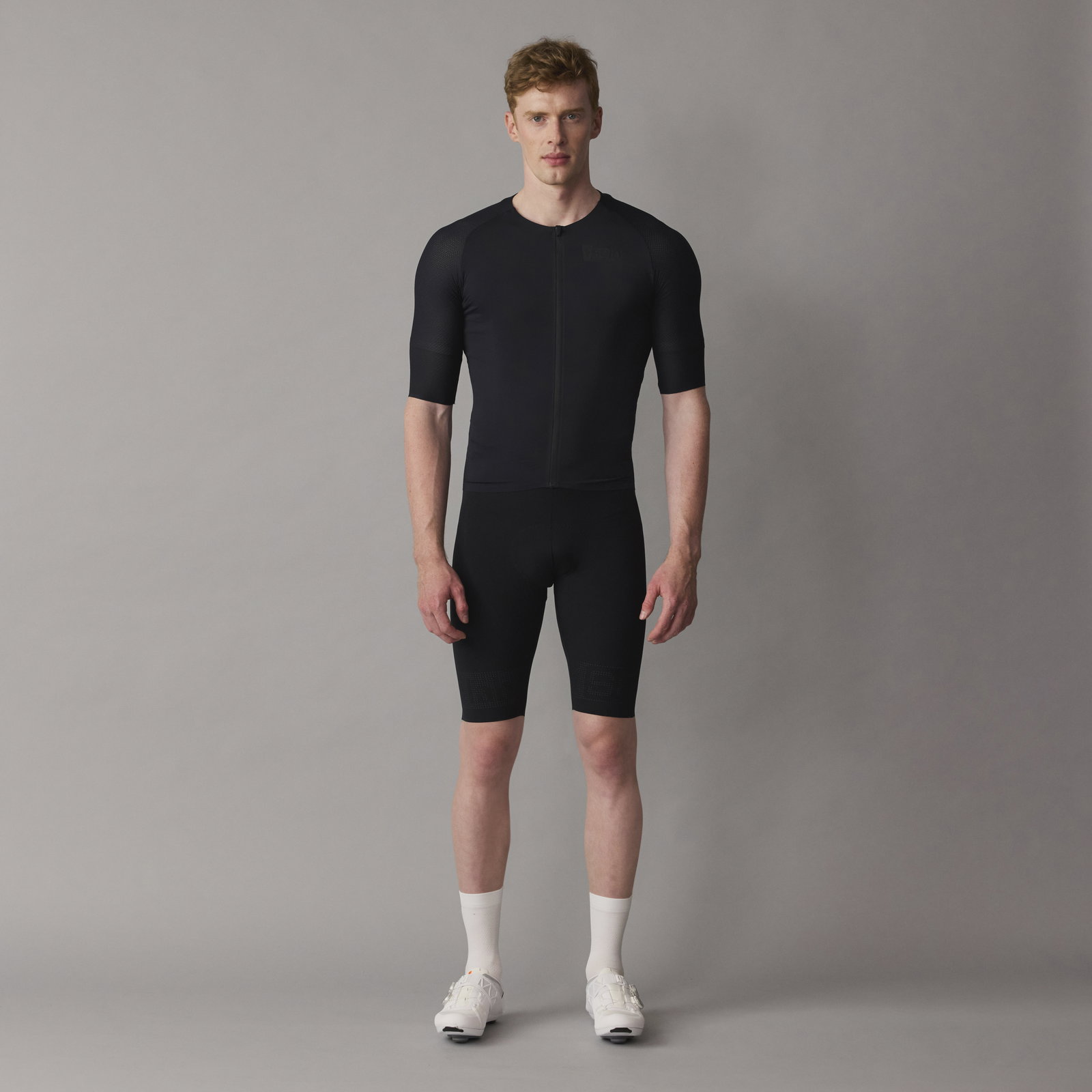 SQlab ONE12 R bib shorts in black for road cycling worn by model showing compression fit and bib straps