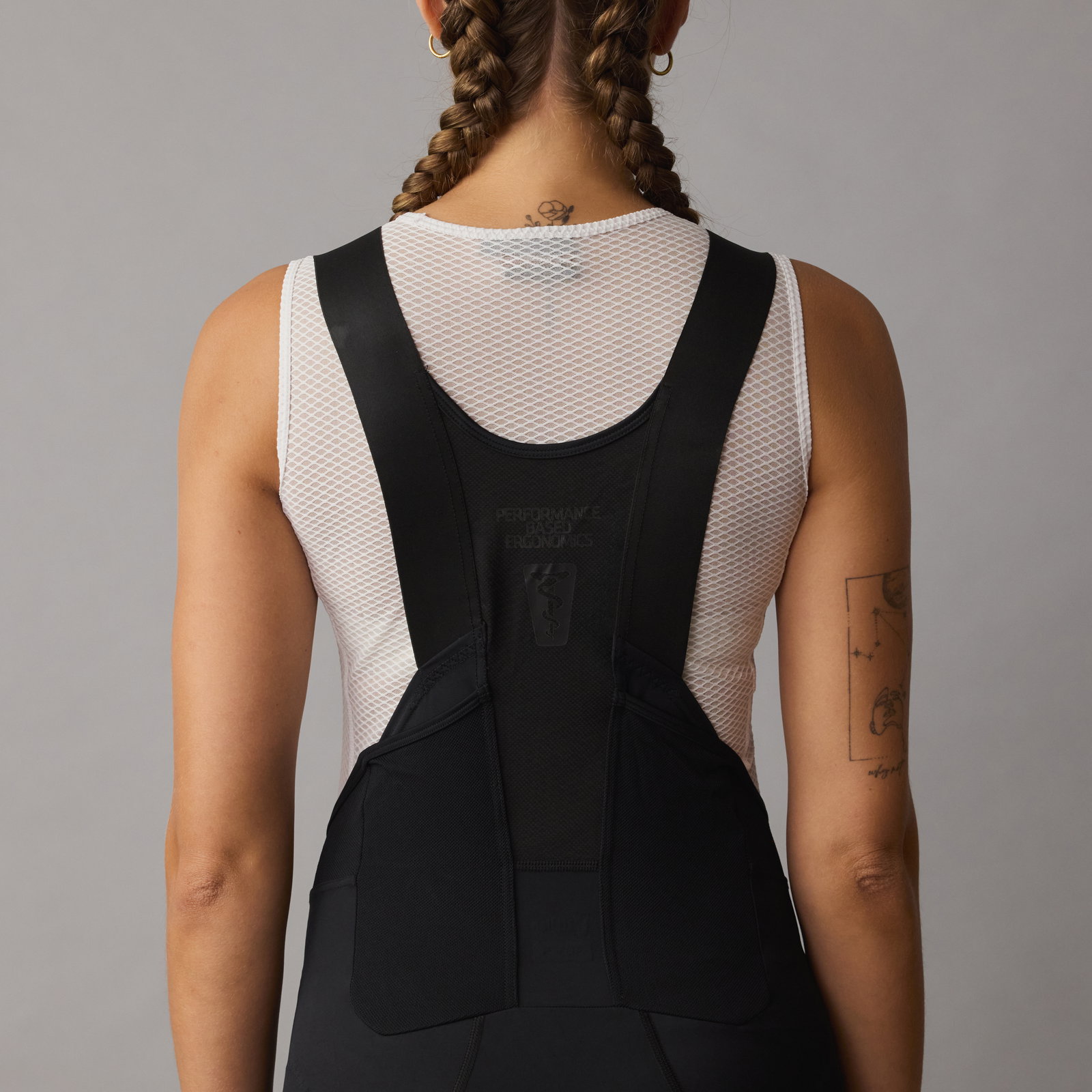 SQlab ONE11 bib shorts in black for mountain biking, back view showing mesh bib straps