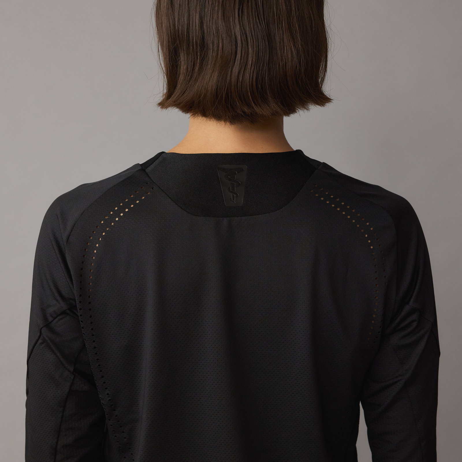 SQlab ONE OX unisex cycling jersey long sleeve in black for mountain biking, back view with laser ventilation