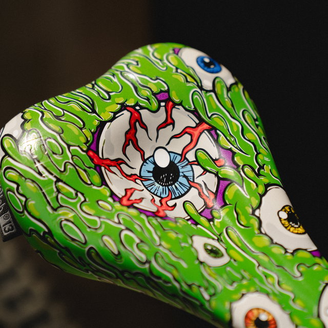 SQlab 6OX ERGOWAVE active 2.2 ltd. Metzger bike saddle in lime green with eyeball graphic print