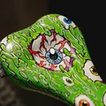 SQlab 6OX ERGOWAVE active 2.2 ltd. Metzger bike saddle in lime green with eyeball graphic print