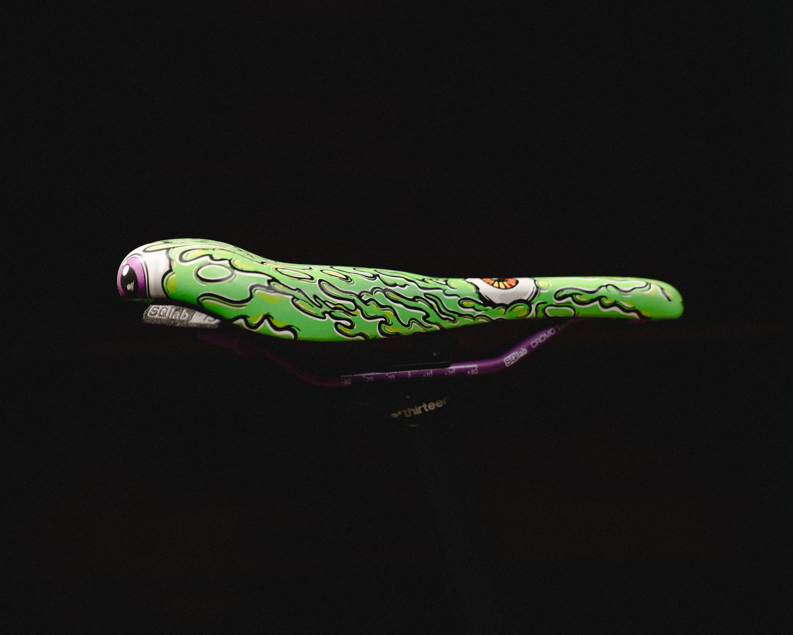 SQlab 6OX ERGOWAVE active 2.2 ltd. Metzger saddle in lime green with signature monster graphic