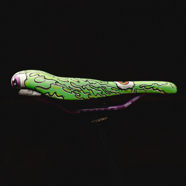 SQlab 6OX ERGOWAVE active 2.2 ltd. Metzger saddle in lime green with signature monster graphic