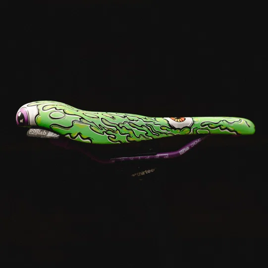 SQlab 6OX ERGOWAVE active 2.2 ltd. Metzger saddle in lime green with signature monster graphic