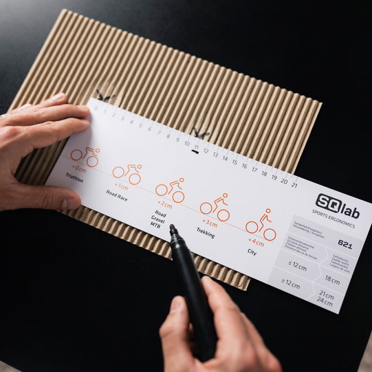 SQlab Measure at Home Set saddle sizing card in use with black marker pen